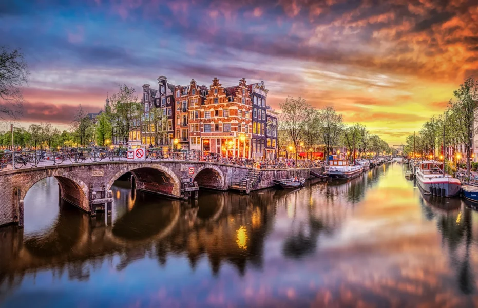 Sunset in Amsterdam. Panoramic view of the historic city center of Amsterdam.